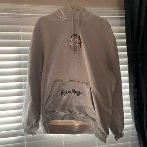 This is a Cream, XL sweatshirt/ hoodie from H&M. The design is Rick and Morty.
